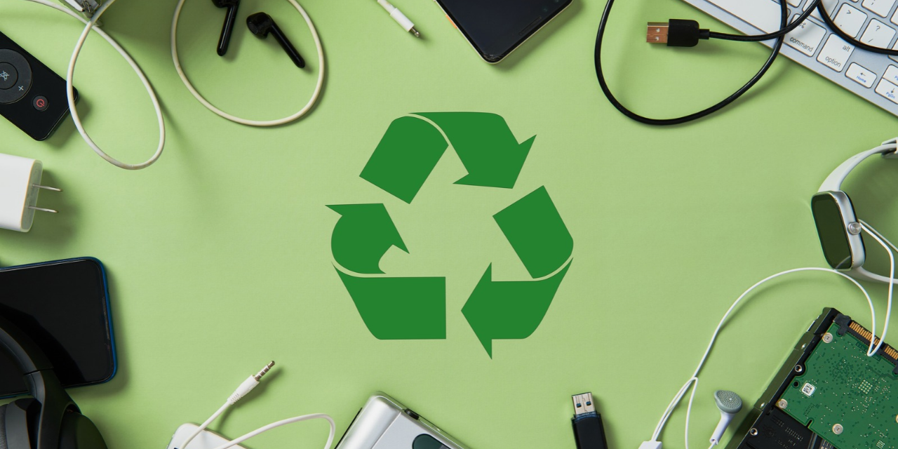 Recycle icon and various electronic items on a green background