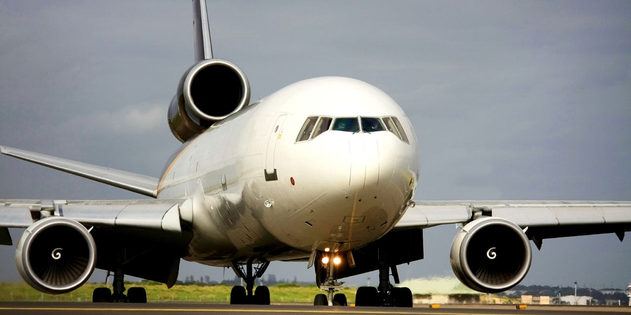 Airplane on runway during the day.