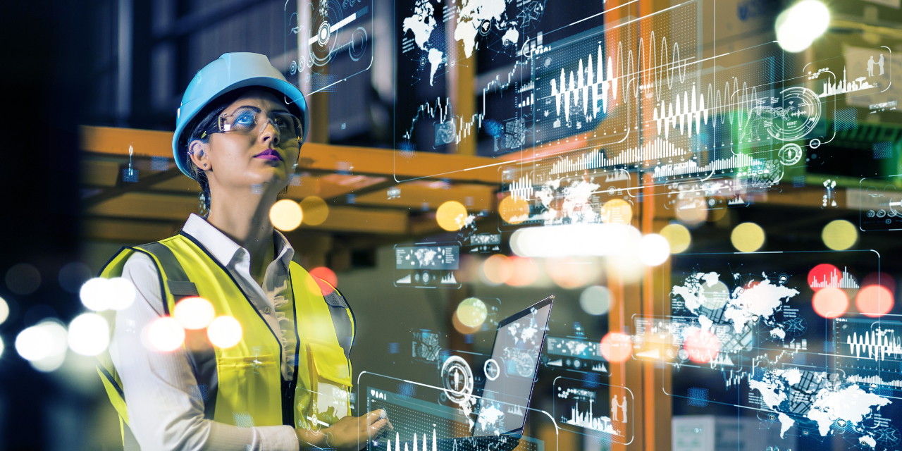 Industrial facility worker reviews digital analytics, highlighting data-driven infrastructure investment.