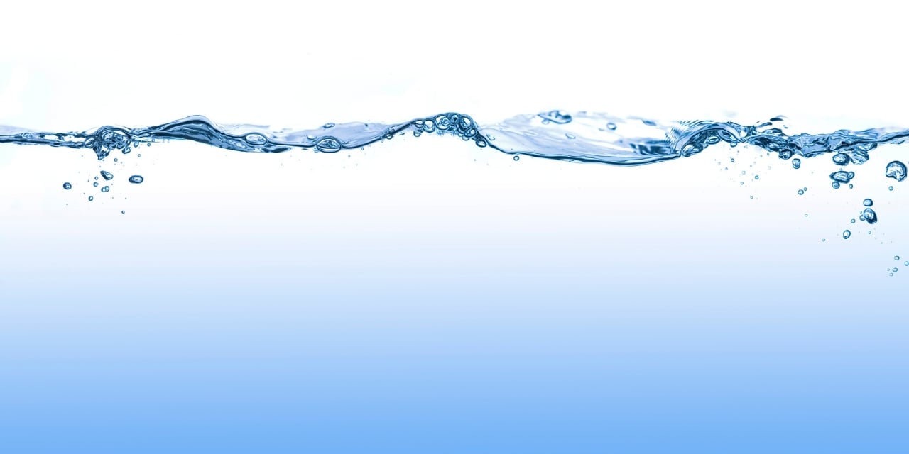 Close up image showing above and below a water line with bubbles