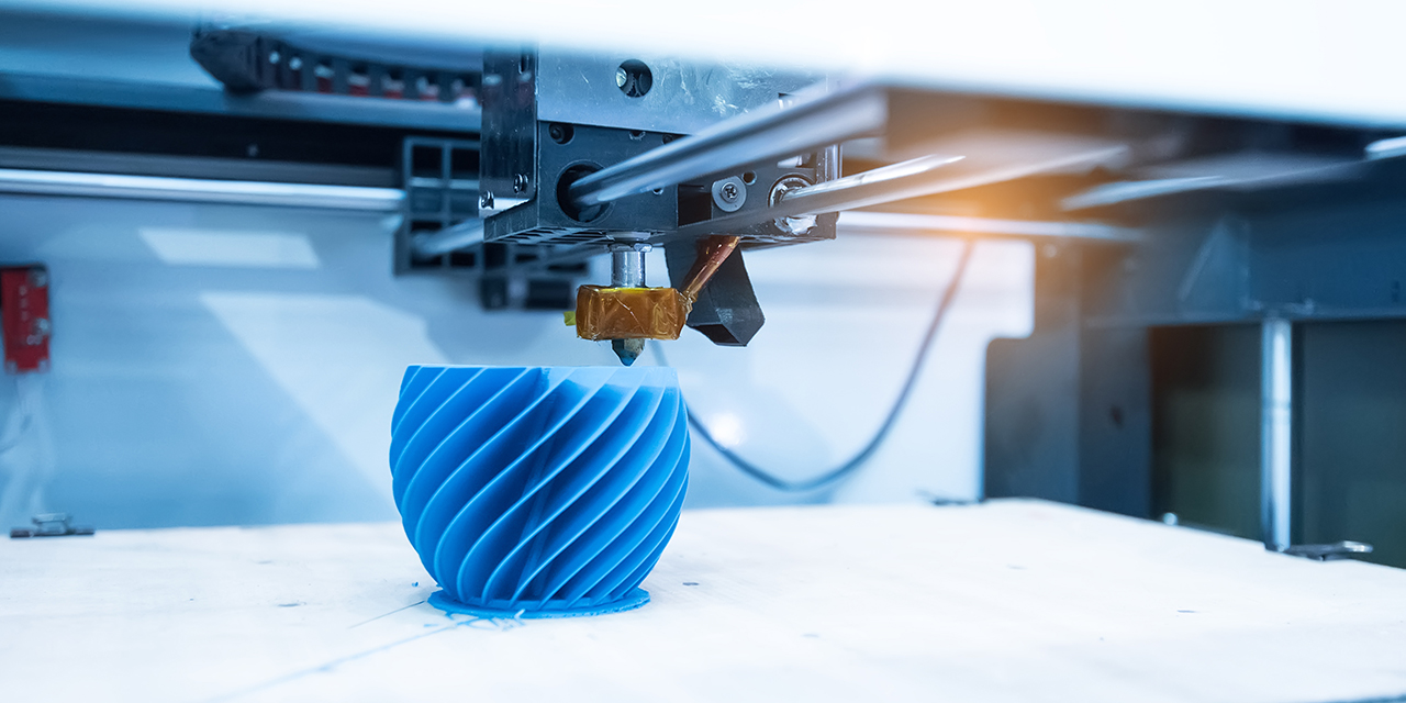 3-D printer creating a blue object