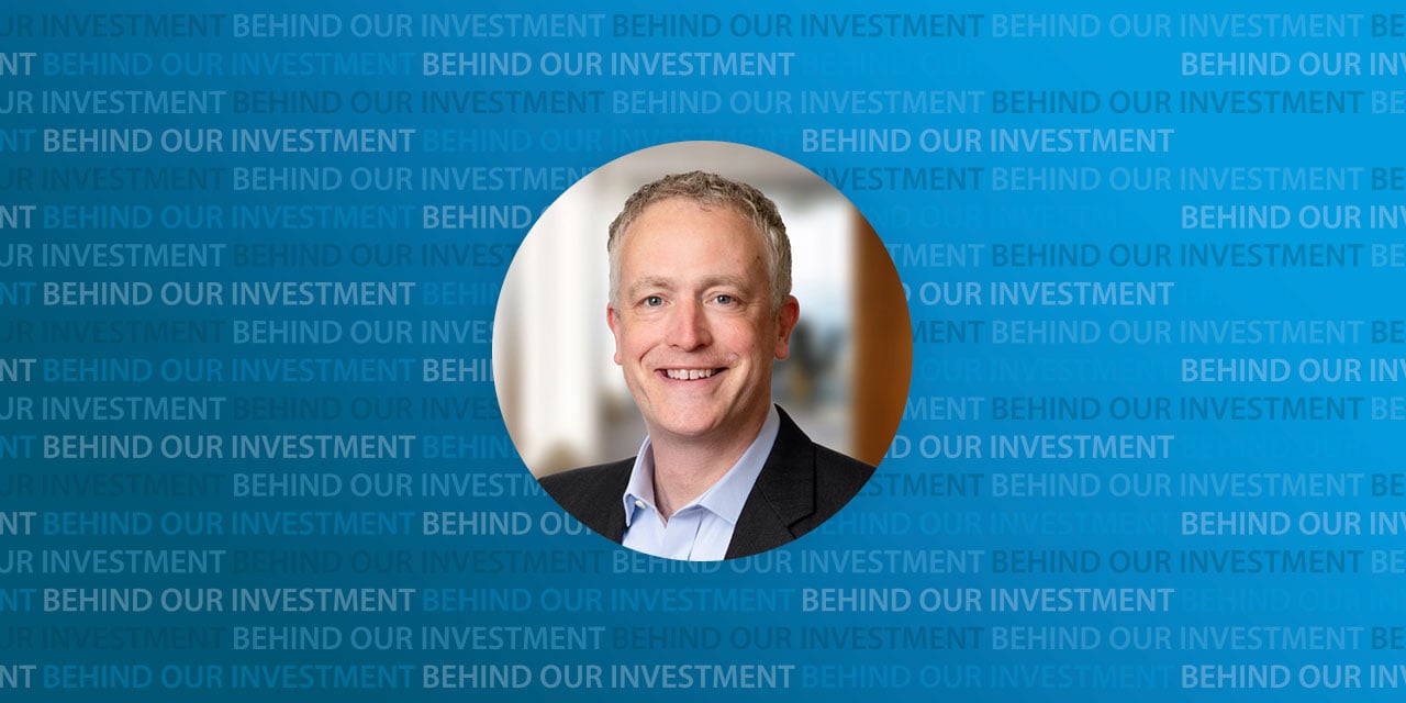 Headshot of James  Benfield with background text 'Behind Our Investment'