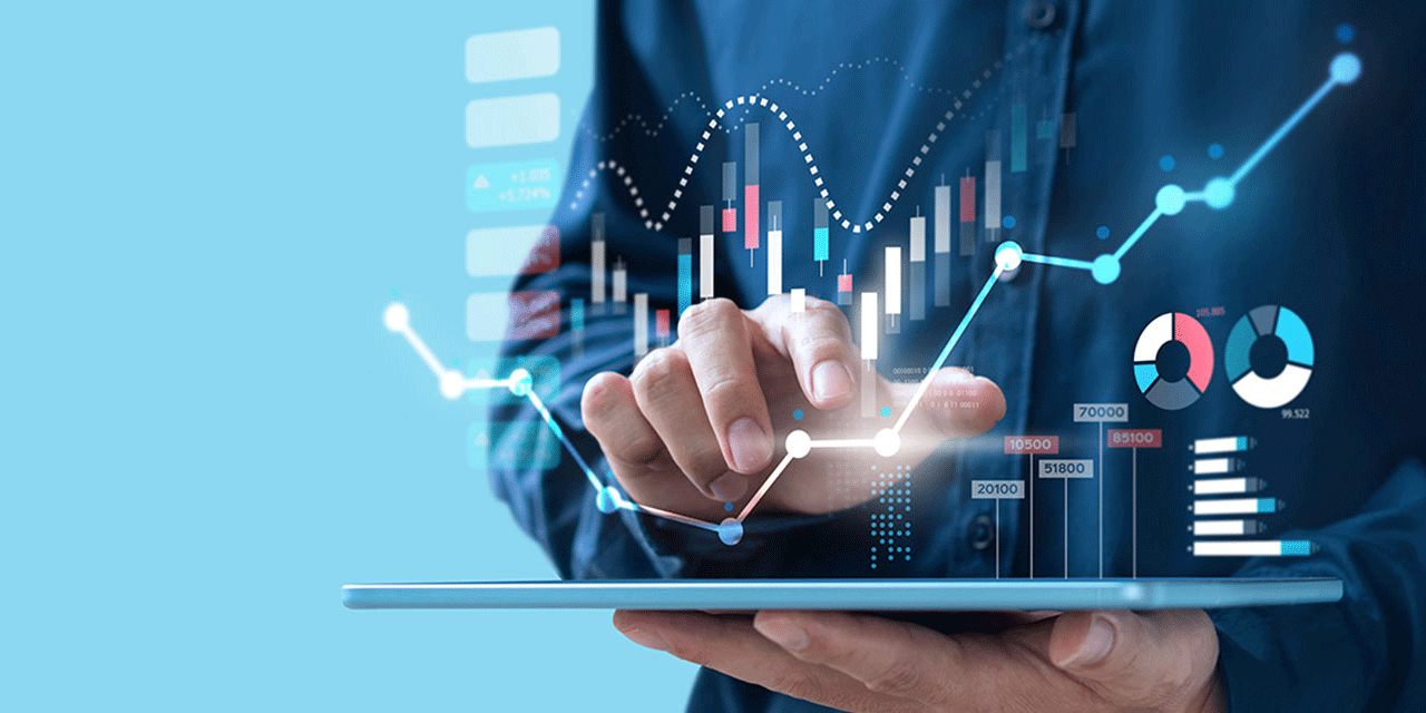 Hands holding tablet with financial graphics superimposed onto image.