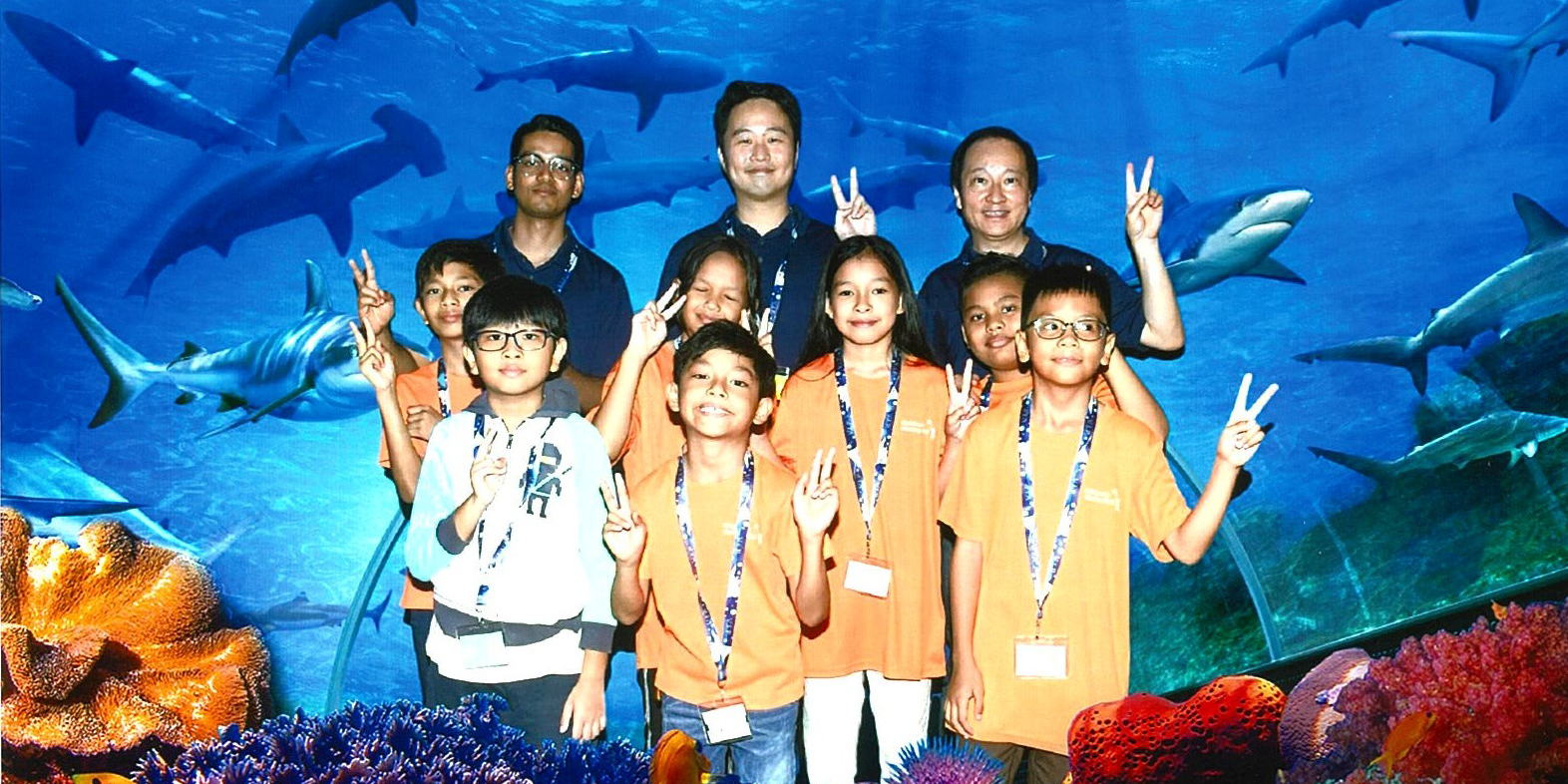 Baird Capital Singapore associates at aquarium with children